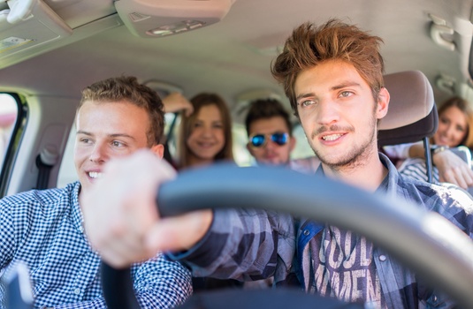 Young adults ride together while learning what age does car insurance get cheaper.