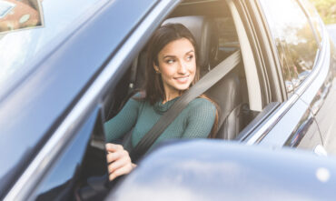 young woman driving car