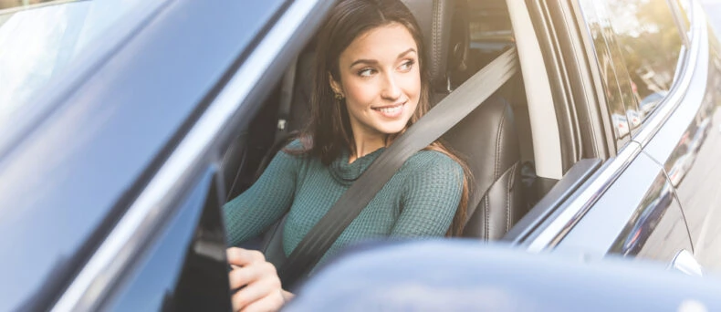 young woman driving car
