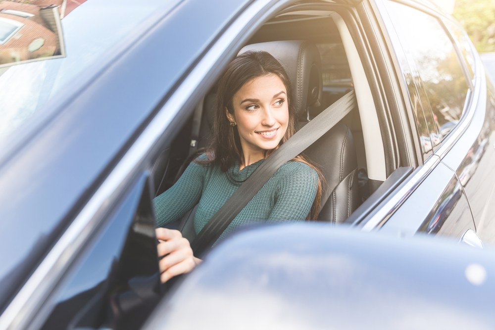 young woman driving car