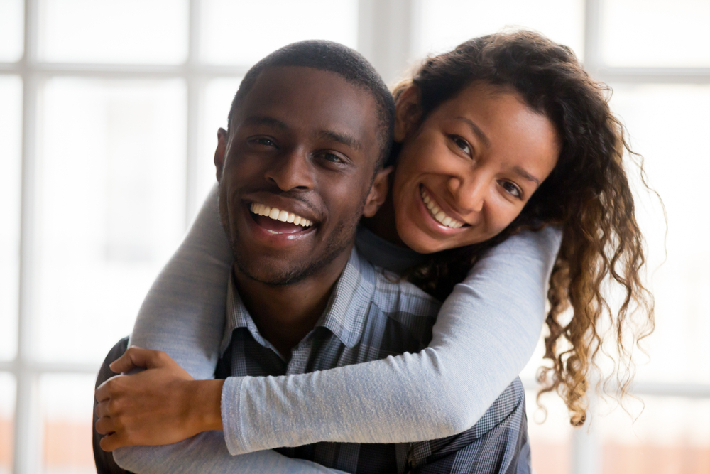 happy african american couple smiling