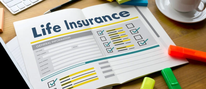 life insurance paperwork on desk