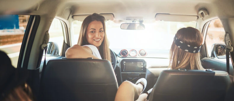 Three woman get ready for a spring road trip in Georgia.