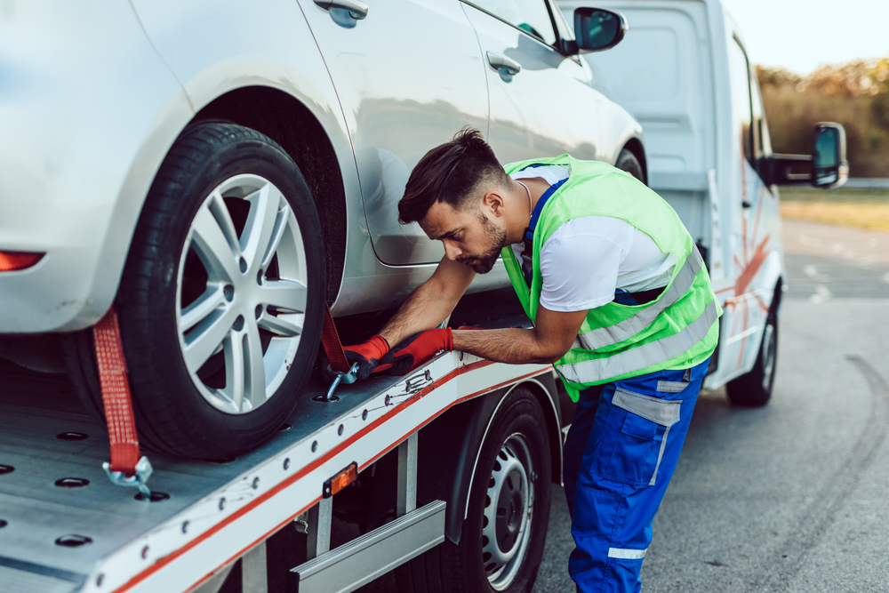 car being towed by towtruck