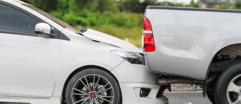 car rear ending truck on road