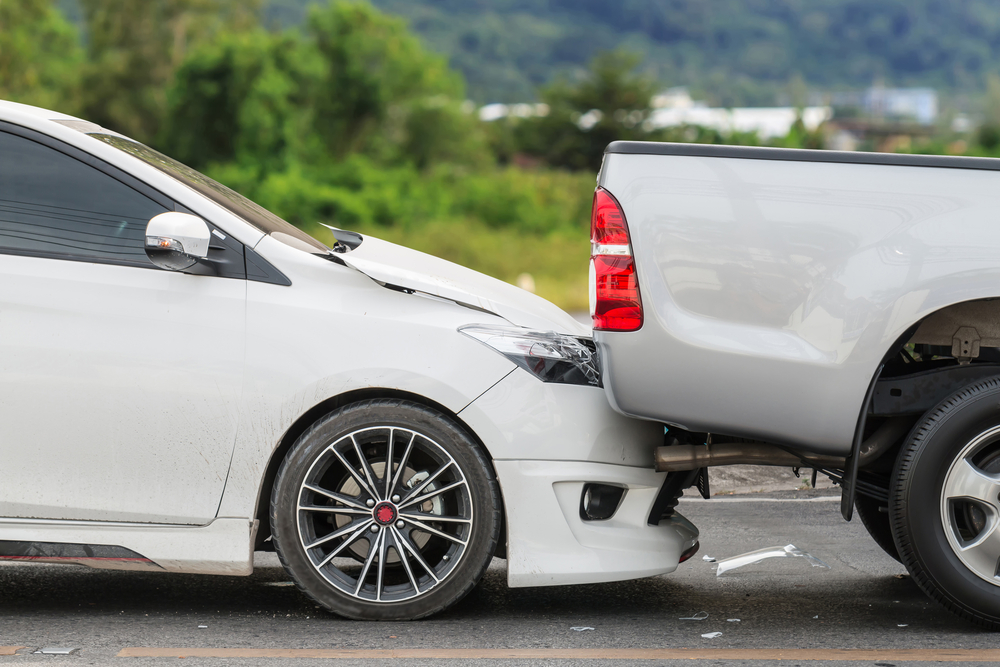 car rear ending truck on road