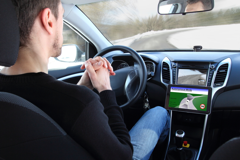 Caucasian man sitting in self driving car