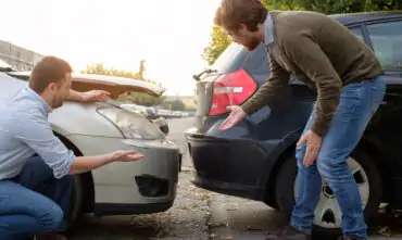 people standing near car collision