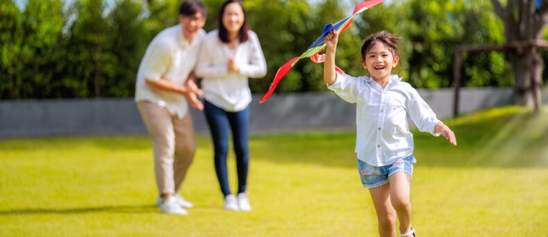family running in yard