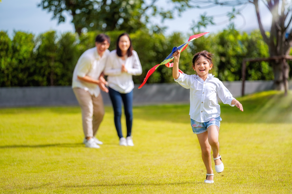 family running in yard