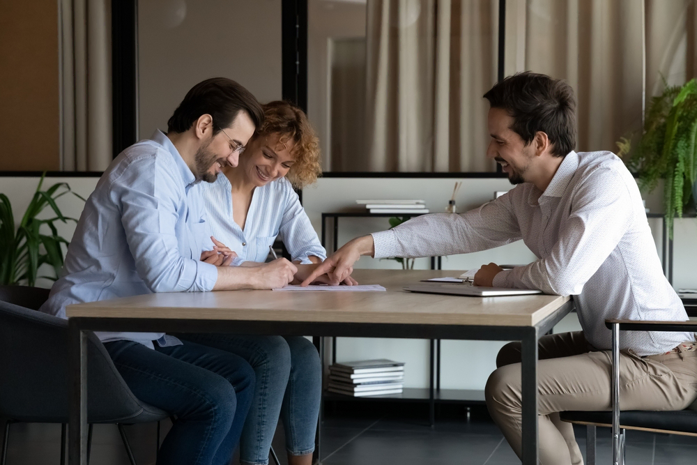 couple meeting with insurance agent