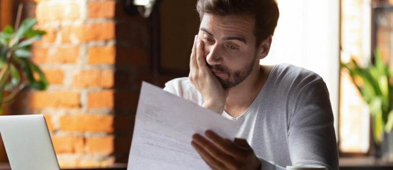 person sitting at desk reviewing paperwork