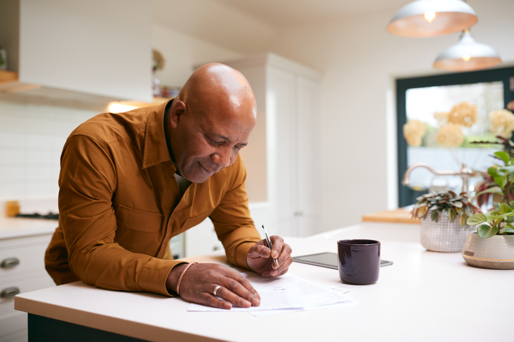 man reviewing insurance policy