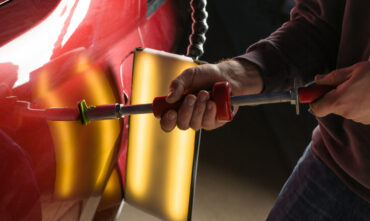 car getting paintless dent repair done