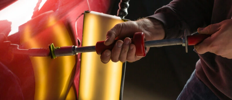 car getting paintless dent repair done