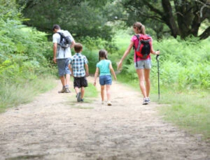 Family on a day trip in Georgia on a path in the woods