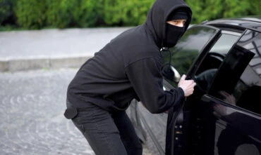 thief stealing a car
