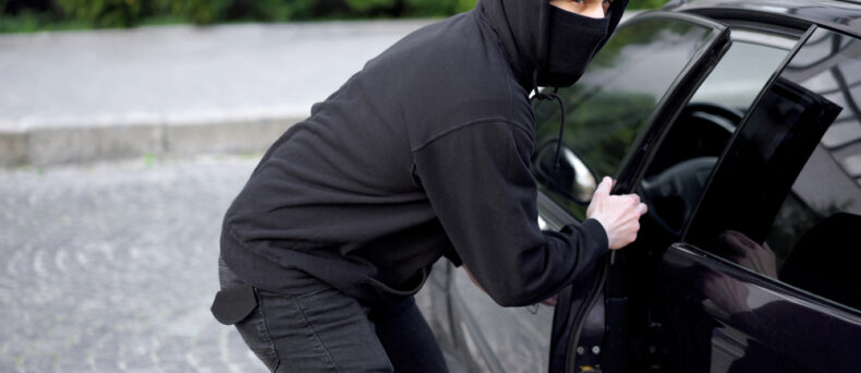 thief stealing a car