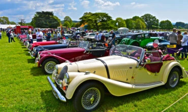 line of classic cars at a car show
