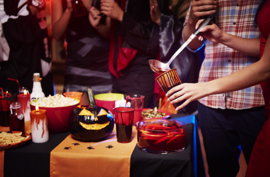 Halloween party with food table in front