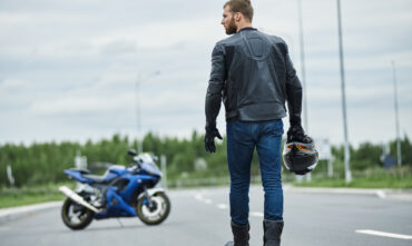 Biker walks back to his motorcycle to start motorcycle ride in Savannah