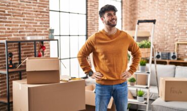 Young male looks around his new apartment in Atlanta