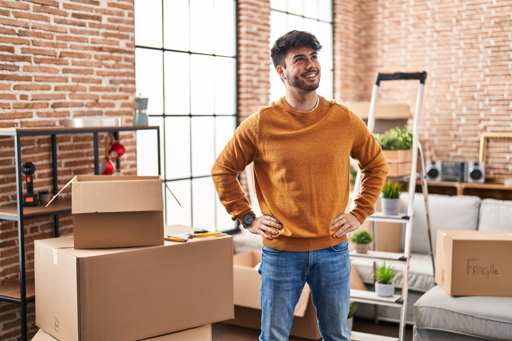 Young male looks around his new apartment in Atlanta