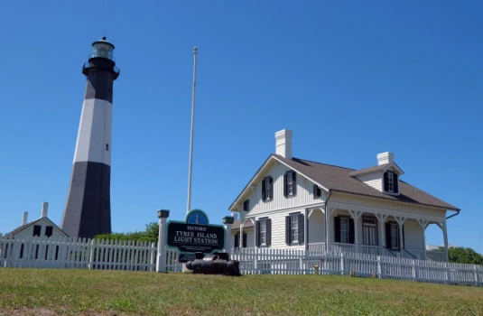 Tybee island lighthouse, on savannah's beach, georgia, touristic destination in oceanside, architectural interest on a sunny day.