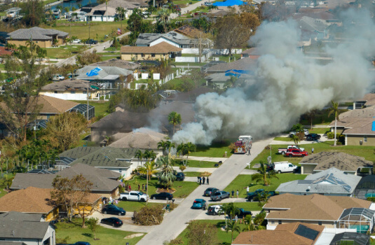 Aerial view of a home on fire - cheap homeowners insurance in Georgia.