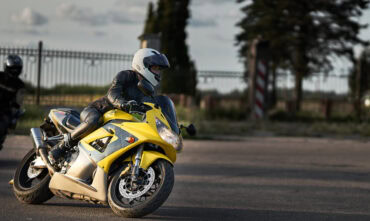 A young woman rides a sport bike - cheap motorcycle insurance in Georgia.