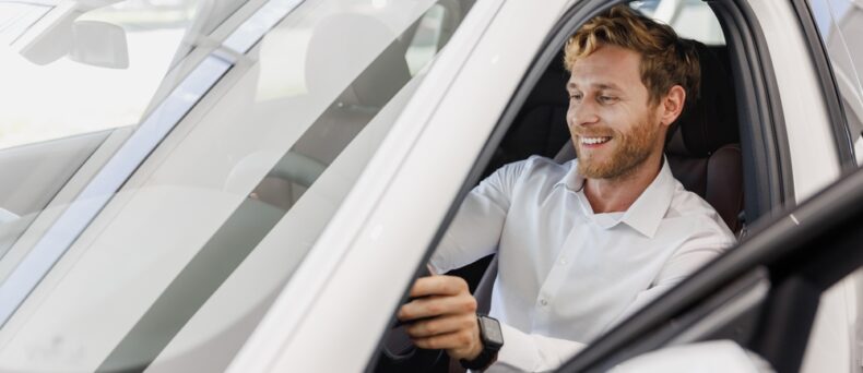 Satisfied smiling man customer buying his new car- Southern Harvest Cheap homeowners in Georgia.