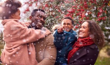 Family enjoying cold weather and snow - best car insurance and home insurance in Georgia.
