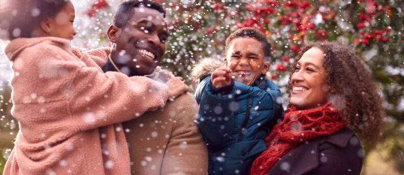 Family enjoying cold weather and snow - best car insurance and home insurance in Georgia.