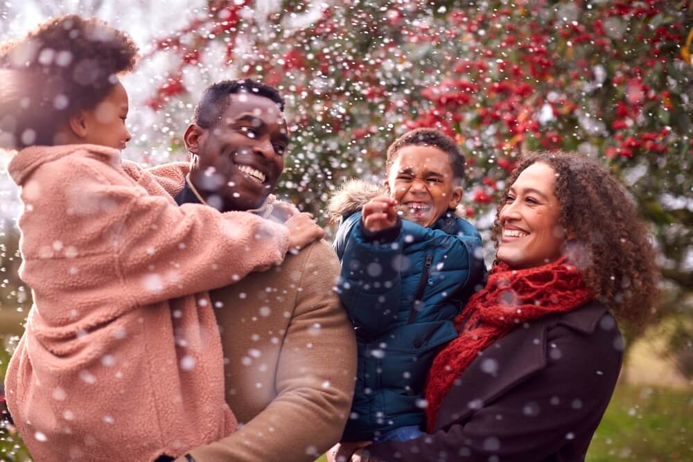 Family enjoying cold weather and snow - best car insurance and home insurance in Georgia.