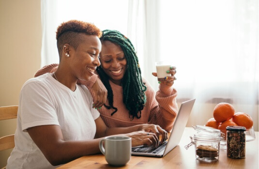 Black female relatives look over their taxes - cheap homeowners insurance in Georgia.