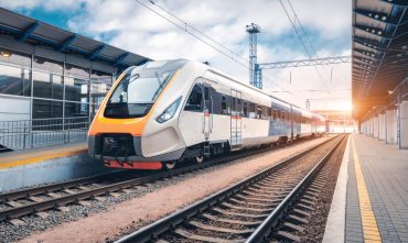 A metro railcar arrives in the station to pick up commuters and travelers.