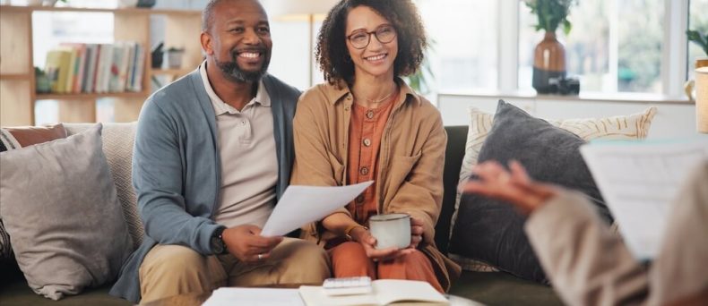 Insurance agent, meeting mature couple on sofa for estate planning, asset management or pension. Documents, life insurance and retirement paperwork with people at home for investment portfolio in Georgia.