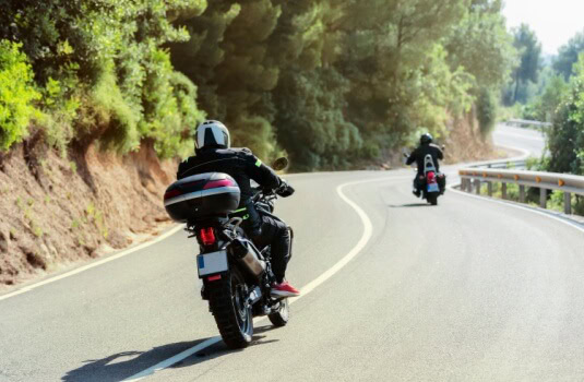 Bikers ride along a Georgia road, cheap motorcycle insurance for protection in Georgia.