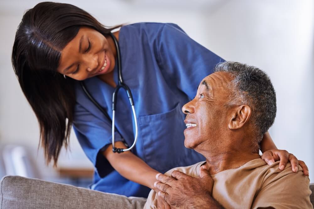 Help, support and wheelchair with nurse and old man for disability, rehabilitation or healing. Retirement, physiotherapy and healthcare with patient and black woman nursing home for medical caregiver, concept of long-term care life insurance.