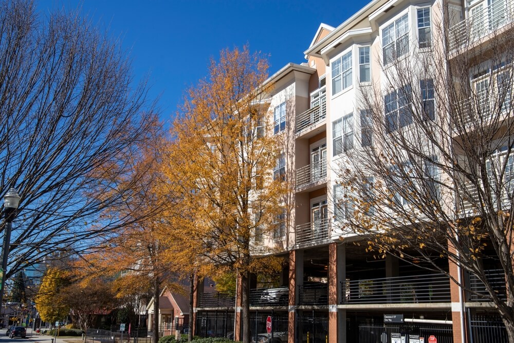 A calm autumn street in Decatur, Georgia, with golden trees and apartment buildings — a fitting backdrop for topics like breaking a lease in Georgia