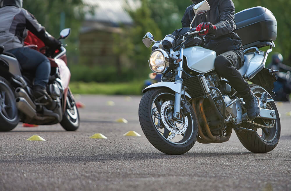 Motorcyclists practicing safety maneuvers during a motorcycle training course in Georgia.
