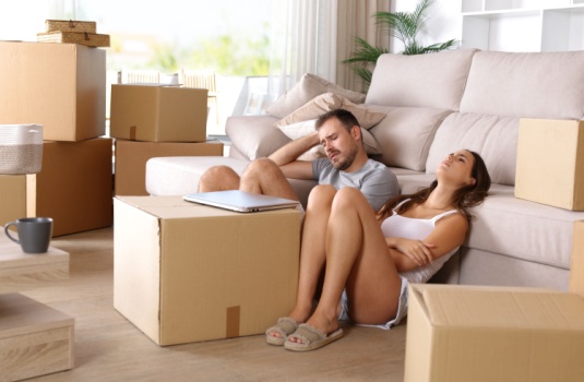 Husband and wife upset about packing to move into their temporary rental.