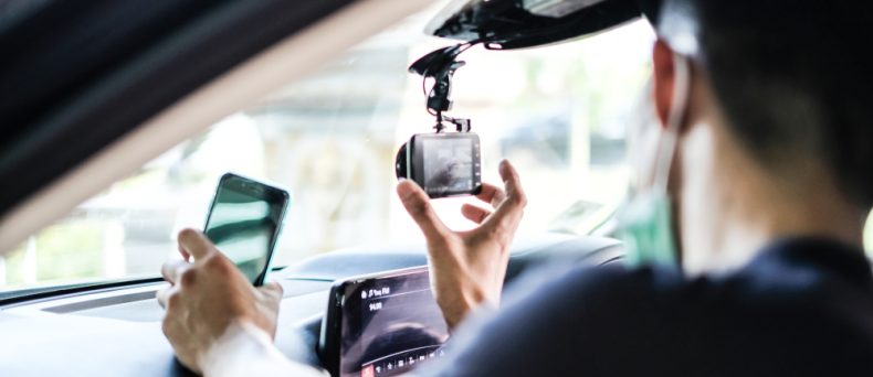 man installing his car cam and understand all of the dashcam benefits.
