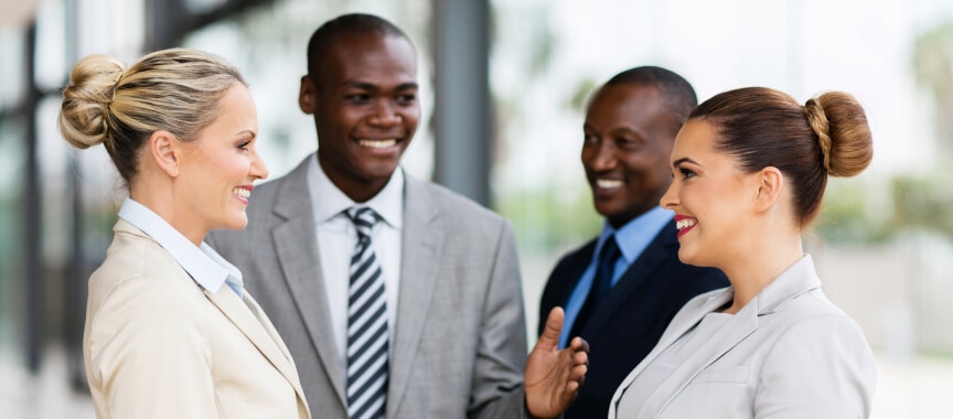 Four business people talking outside