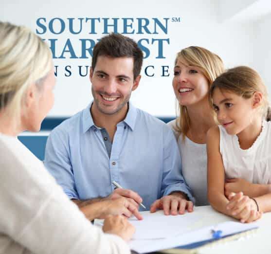 Happy family with parents and one girl in southern harvest office with agent