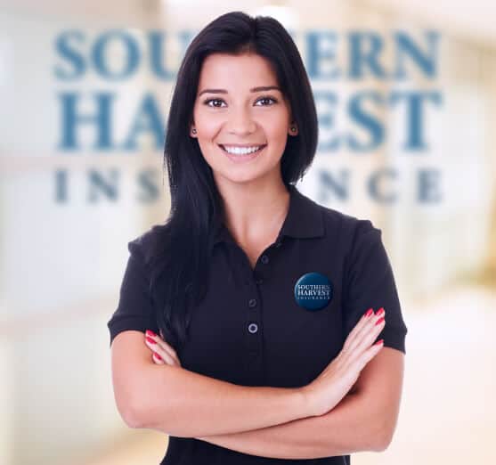 Portrait of smiling female southern harvest agent with brand logo in the brackground