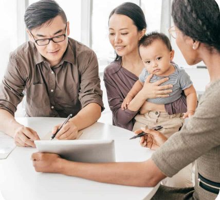 Asian american family with baby with insurance agent signing life policy