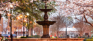 Macon, Georgia, USA downtown square in spring season with the fountain -cheap car insurance in Georgia.
