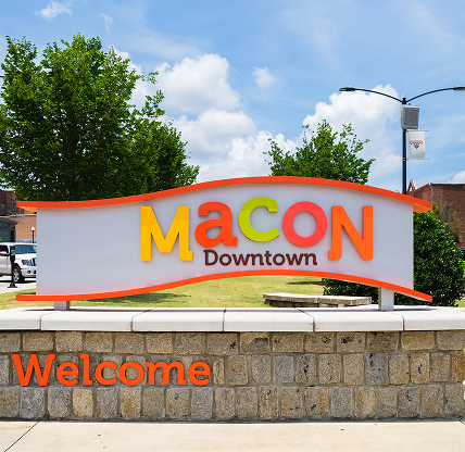 Cityscape scene with welcome sign in the historic downtown district - cheap car insurance in Georgia.