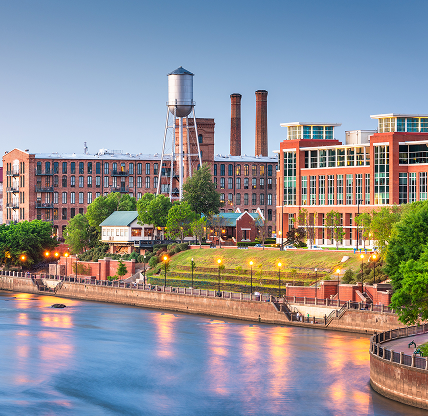 Columbus, downtown skyline on the Chattahoochee River at dusk - cheap car insurance in Georgia.